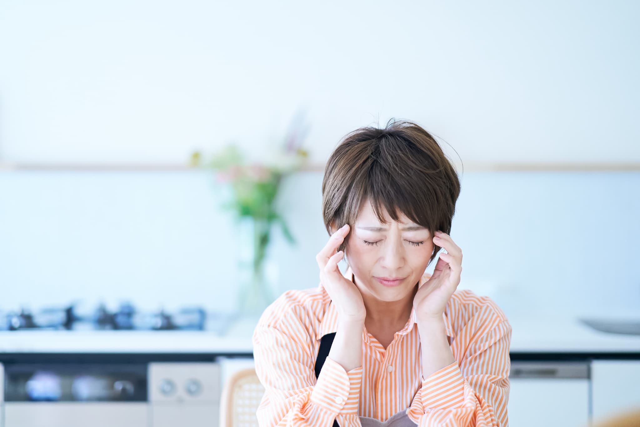 めまいがする女性