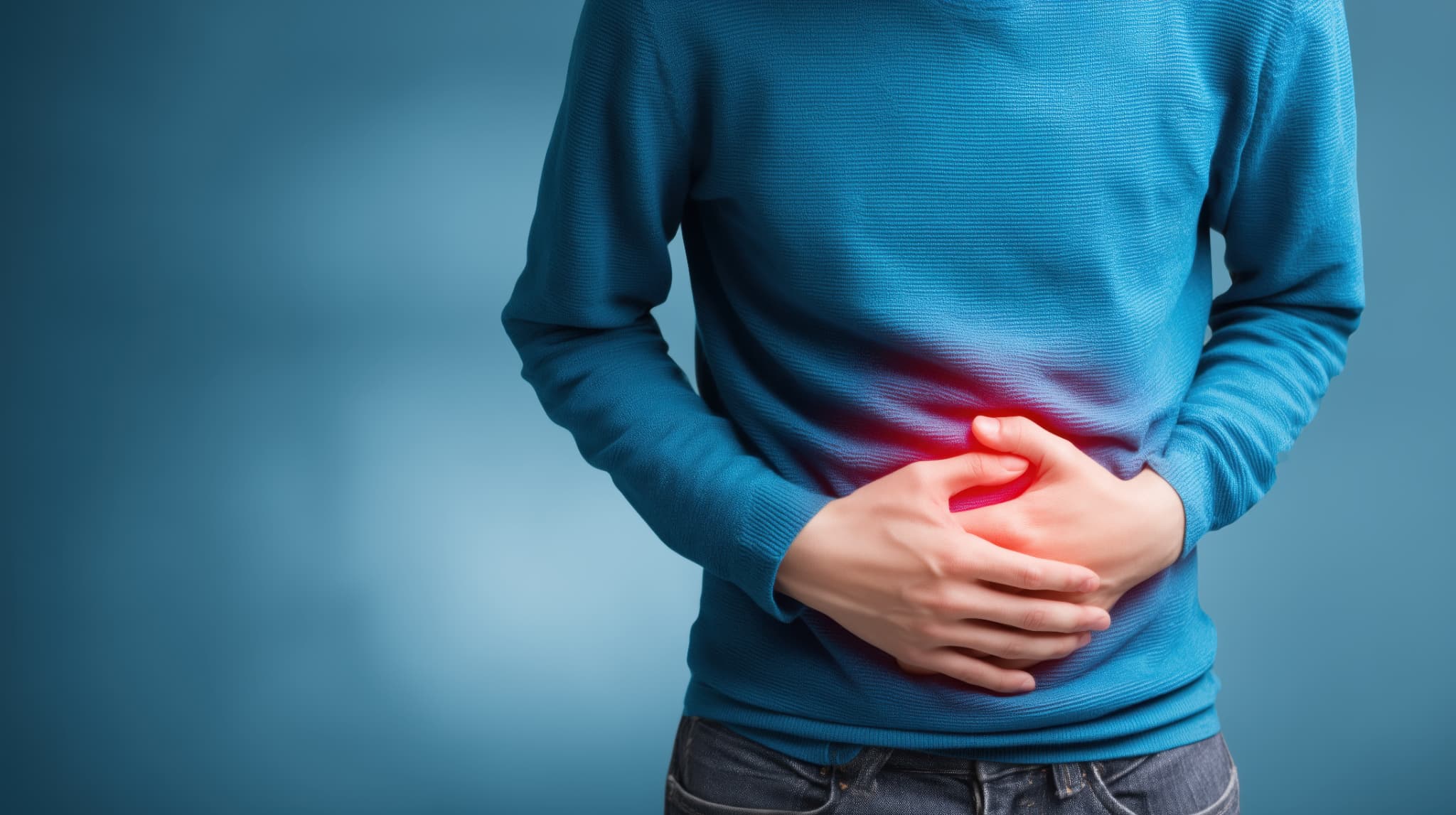 腹痛を感じる男性