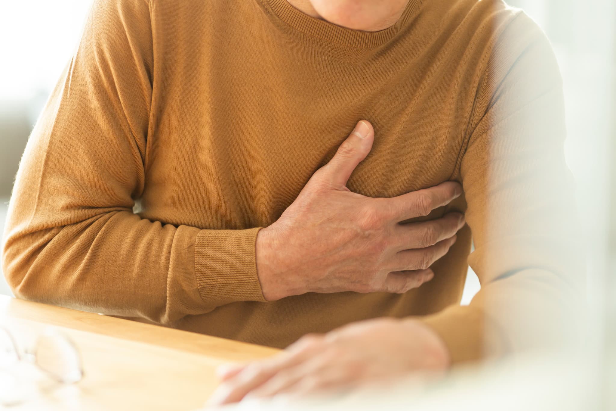 体調を崩した男性